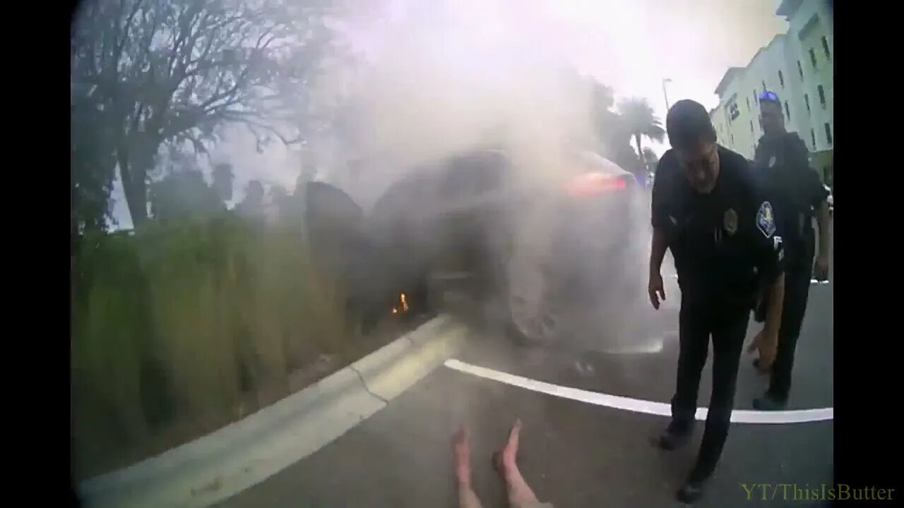 Four officers hospitalized after pulling man from burning car