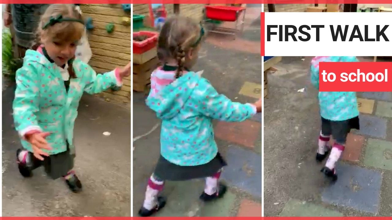 Little girl with cerebral palsy walks into school for her first day