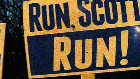 Scott brown in Nashua 12 19 13 Two Signs