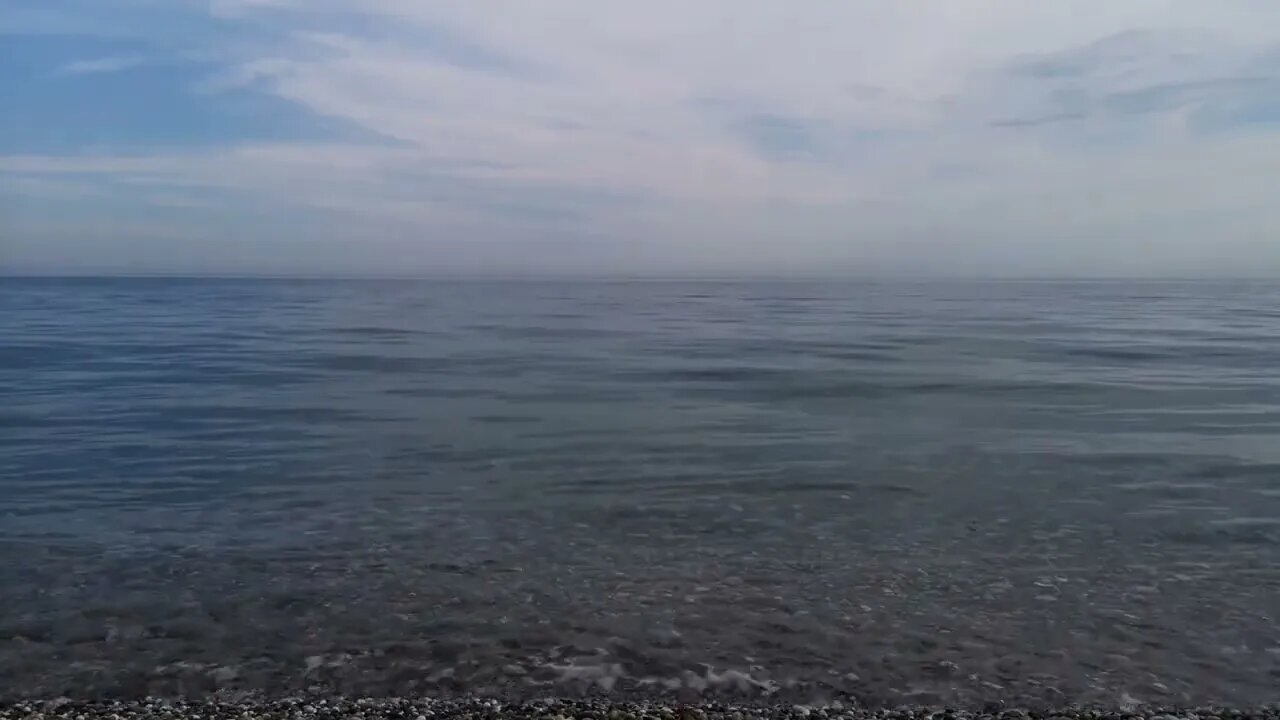 beaches waves on pebble shore