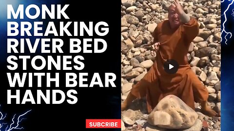 Monk Breaking River Bed Stones with Bear Hands