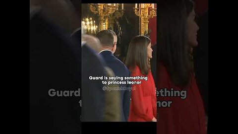 Guard is saying something to princess leonor