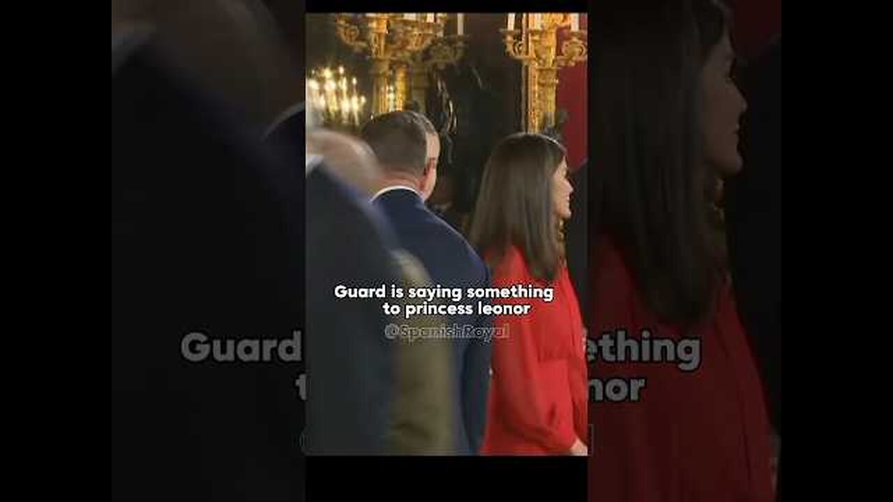 Guard is saying something to princess leonor