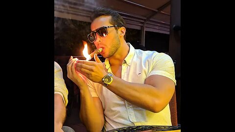 Tristan Tate smoke's a $1300 cigar