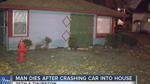 Man dies after crashing car into house