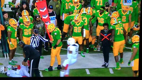 OregonDucka Heisman Candidate #8 Dillon Gabriel gets smoked on the sideline.