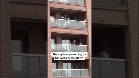 People sing from balconies during lockdown in Shanghai