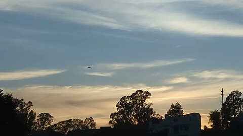 Blue sky, clouds, and trees.