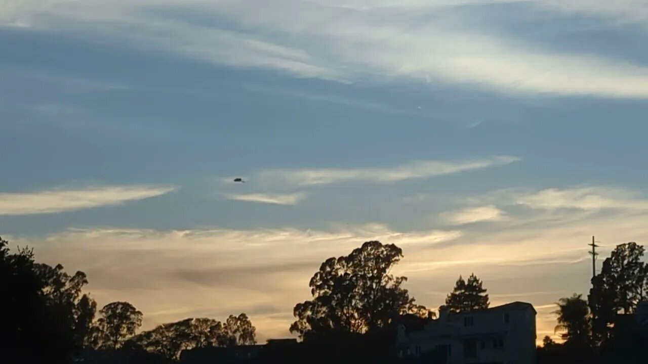 Blue sky, clouds, and trees.