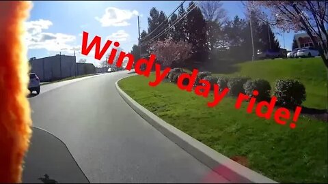 Riding a motorcycle / Scooter in the wind.