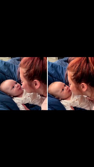 Mom preciously gives her baby loving kisses