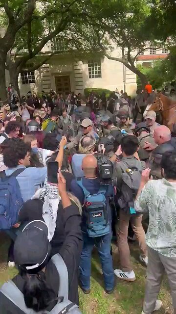 FOX 7 reporter seems to assault police officers & quickly arrested.