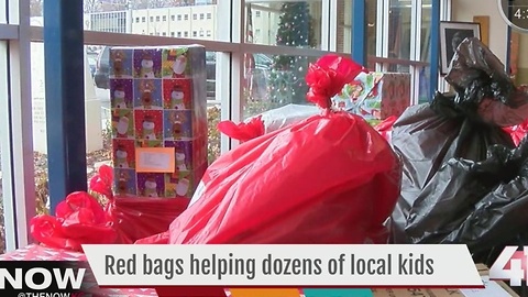 Dozens of red bags help families in need