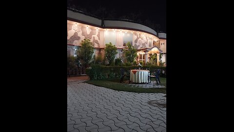 It's a hotel garden 's water fountain enhanced attraction of visitors.