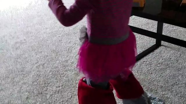 Toddler wears Christmas stockings on her feet