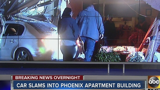 Car slams into Phoenix apartment building