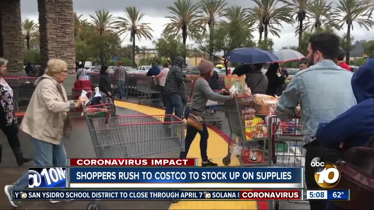 Shoppers rush to Costco to stock up on supplies