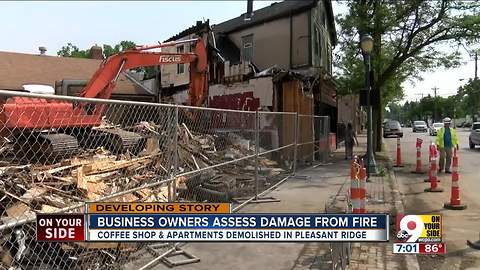 Business owners assess damage from fire