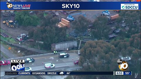 Semi-truck crashes off freeway transition ramp