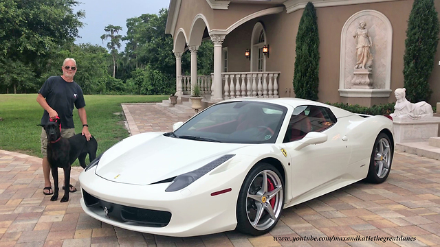 Great Dane sits in Ferrari for music video shoot