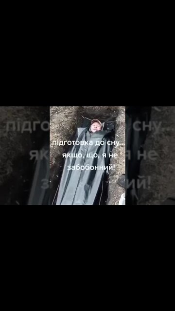Ukrainian officers sleeping in bodybags in graves