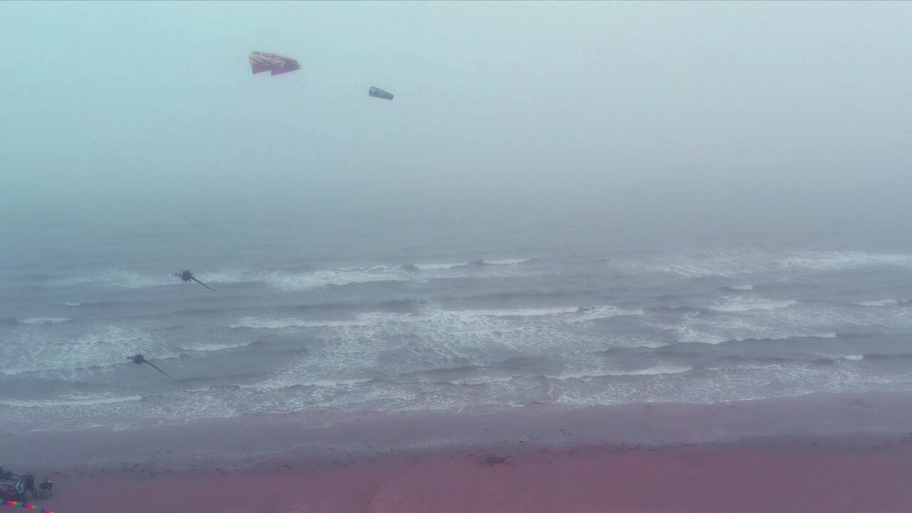 Drone footage captures kite flying on a foggy day in Texas