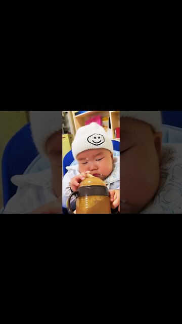 Cute adorable baby child with warm white and pink hat with cute baby girl