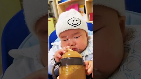 Cute adorable baby child with warm white and pink hat with cute baby girl