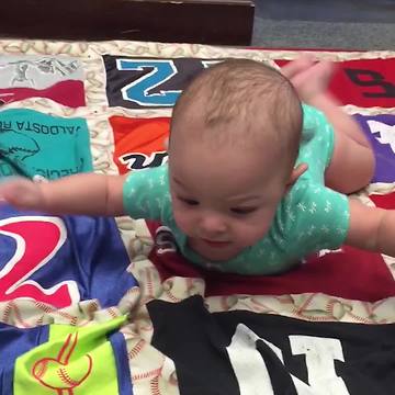Little Baby Boy Is Doing Tummy Time Like Superman