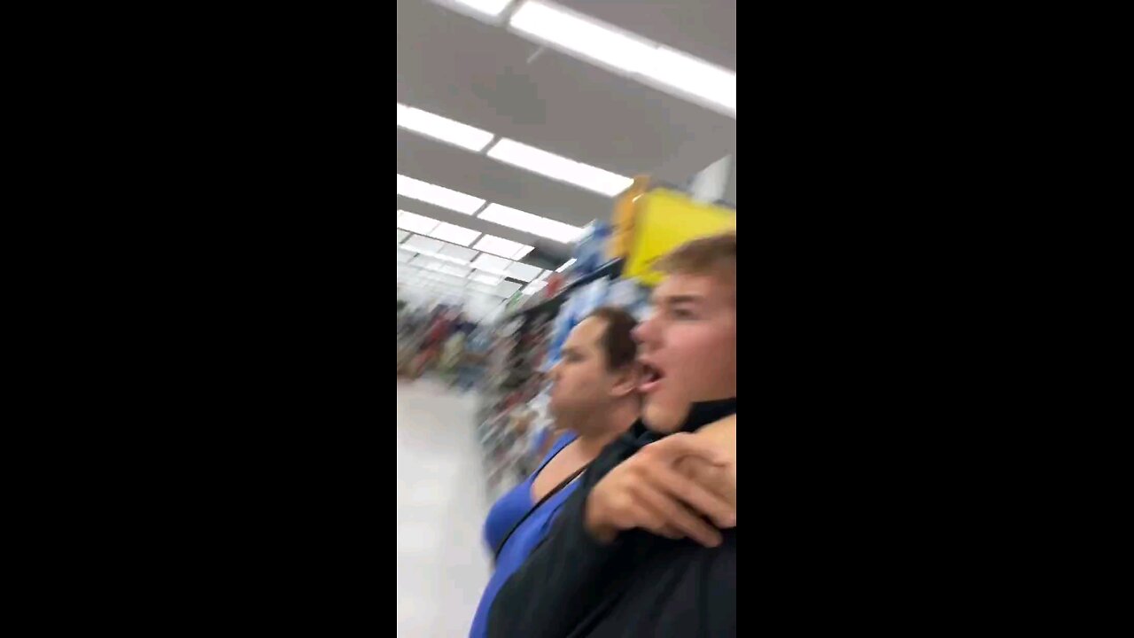 Transgender man puts influencer in a HEADLOCK while dragging him through a supermarket and shouting.