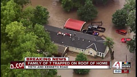 Family of 7 stranded on rooftop in Overland Park