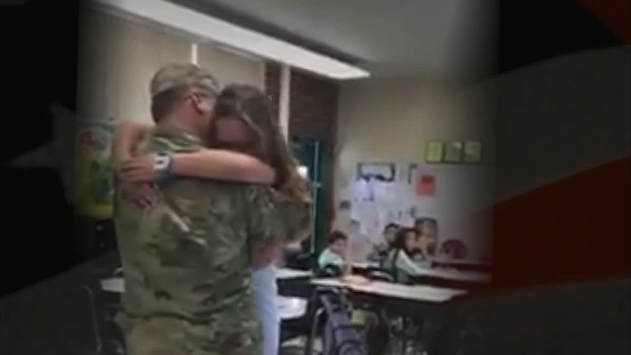 Soldier surprises step-children in school after year-long deployment