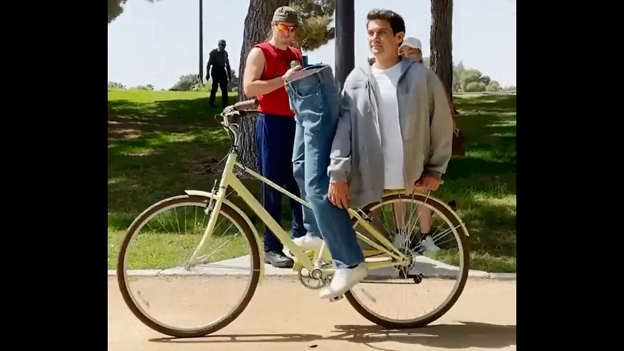 MAN CUT IN HALF ON A BIKE