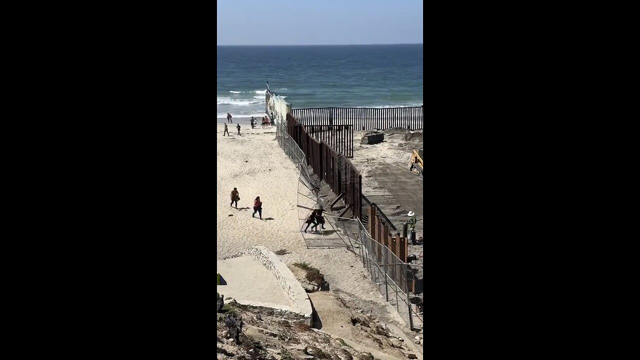 Illegal aliens rip down a fence to cross the border in San Diego Ca.