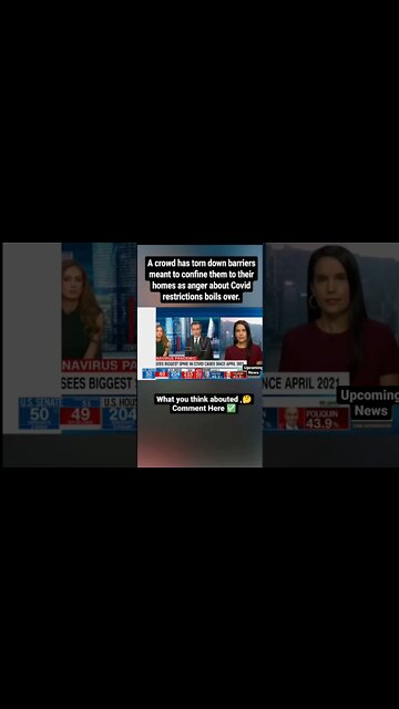 A crowd has torn down barriers meant to confine them to their homes as anger about Covid restric