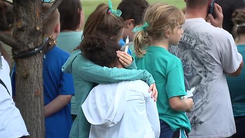 Hundreds gather at vigil to remember 8-year-old girl struck, killed by car in her driveway