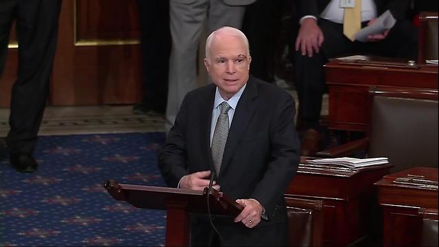 Cheers, whoops for McCain's return, then impassioned speech