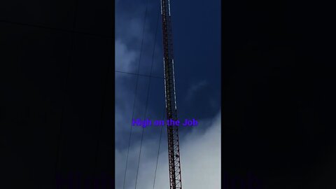 Massive tower with workers