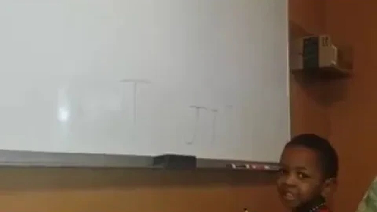 TJ Writes on the White Board