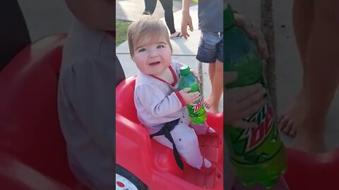 Baby trying to get Mt. Dew