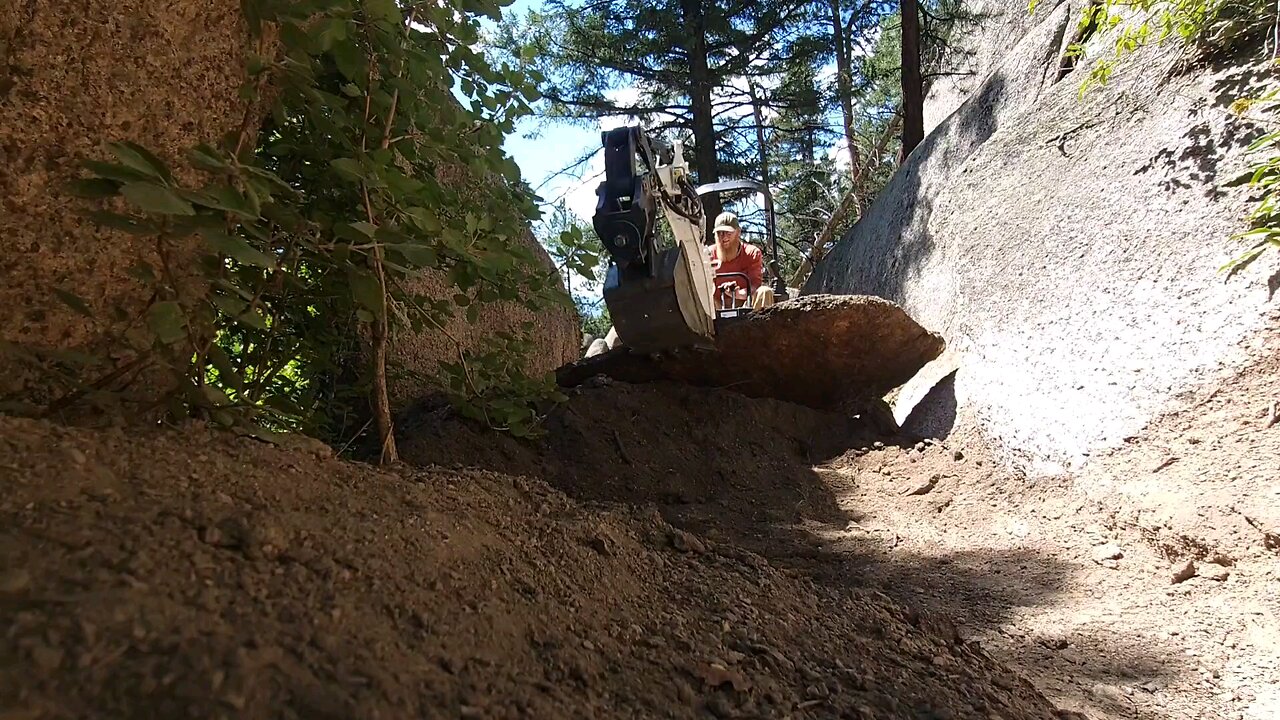 fixing single track, using a rock