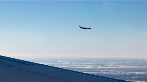 An airplane landing next to my plane