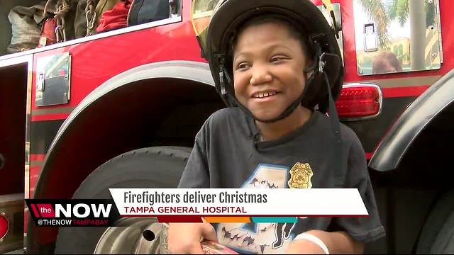 Tampa Fire Rescue brings holiday cheer to kids with cancer at Tampa General Hospital