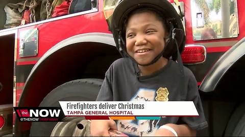 Tampa Fire Rescue brings holiday cheer to kids with cancer at Tampa General Hospital