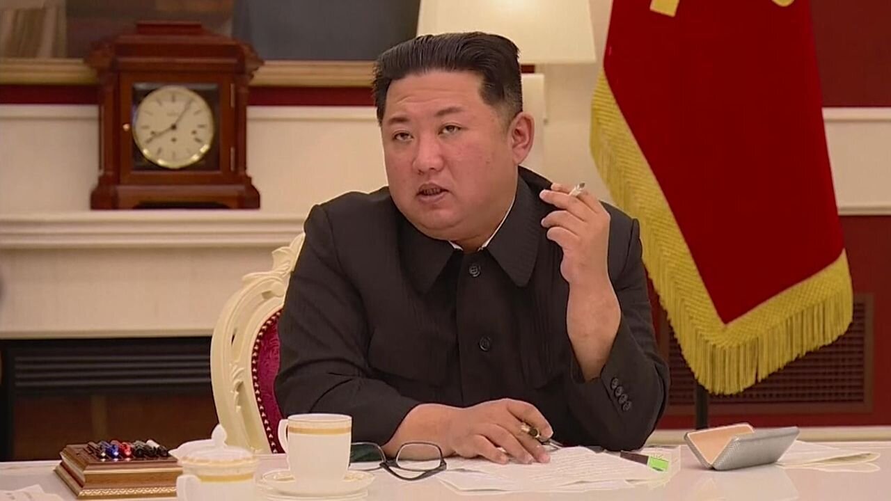 Kim waves cigarette during COVID meeting