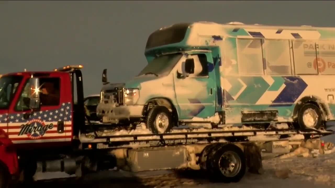 Drivers come back to DIA to pick up their cars after they were stranded at Pena Boulevard during the snowstorm