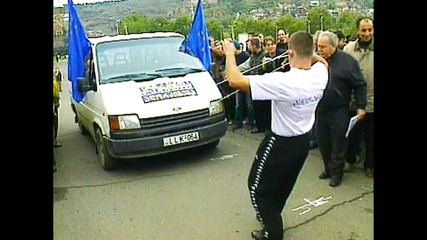 Man Pulls Minivan With Ears