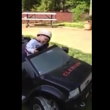 Kid adorably falls asleep at the wheel