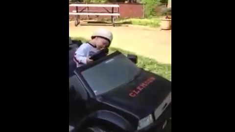 Kid adorably falls asleep at the wheel