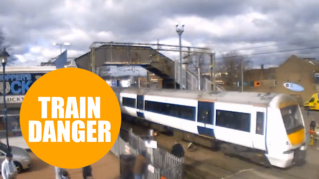 Shocking footage shows people risking their lives crossing train tracks